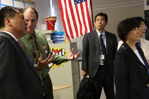Principal Mark Newell speaks with a visitor from Columbus' sister city: Miyoshi, Japan.