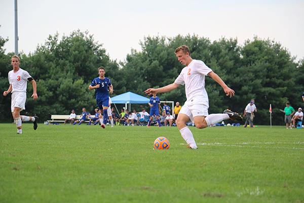 Sophomore Scott Hammond passes the ball during the match against Columbus North