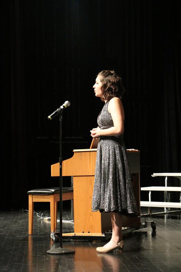 Junior Lauren Wagner sings during Monday nights performance.