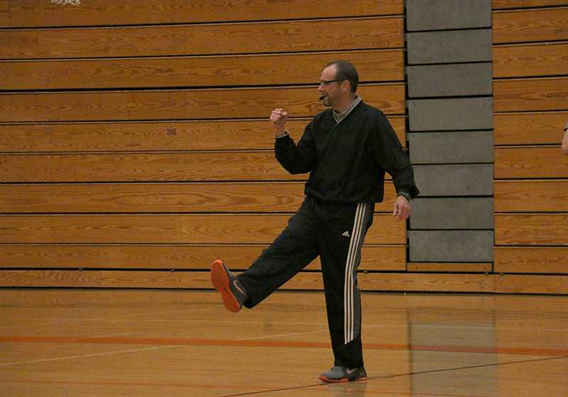 Girls basketball coach Danny Brown reacts to a play during practice.
