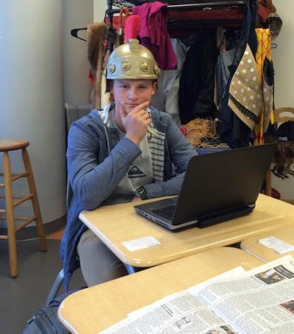 Senior Jacob Harpring, hard at work during Newspaper class.