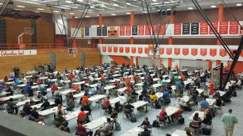 Juniors and sophomores enter the main gym and take their seats before the PSAT on October 14.