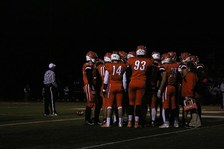 The East football team huddles before calling another play last week against the Whiteland Warriors. 