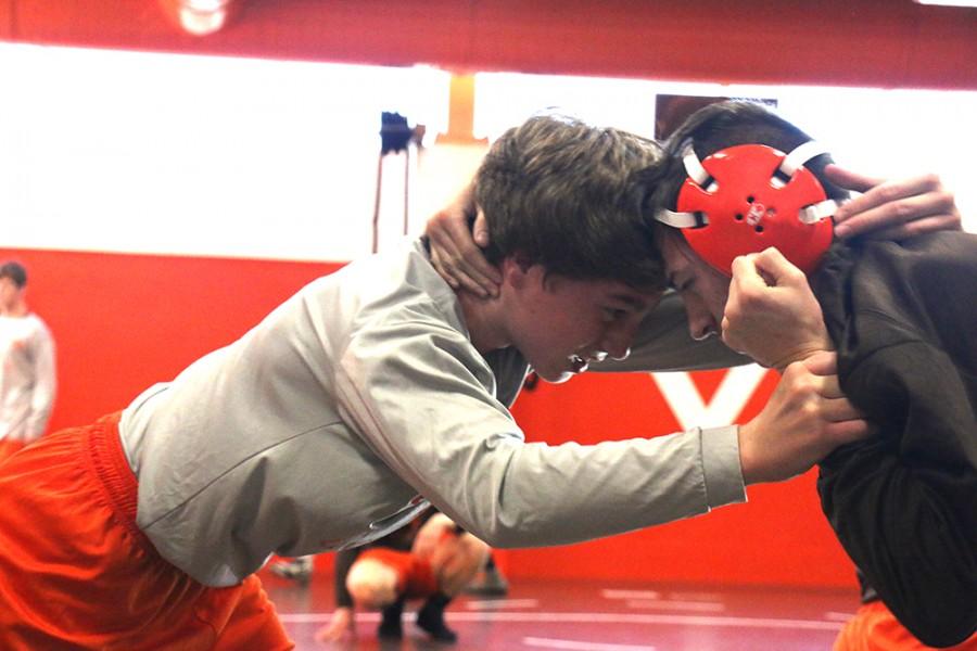 Junior Cole Schultheis (right) and sophomore Corban Pollitt (right) wrestle during an after-school practice. 