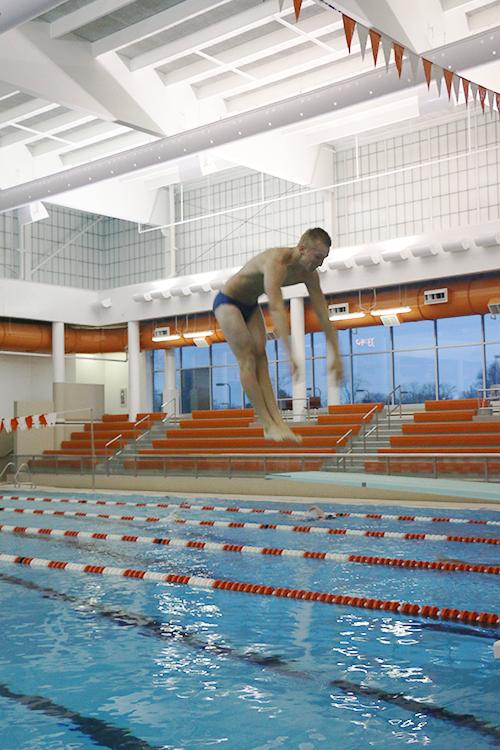 Senior Cordell Glass practices his dives for the upcoming meet.