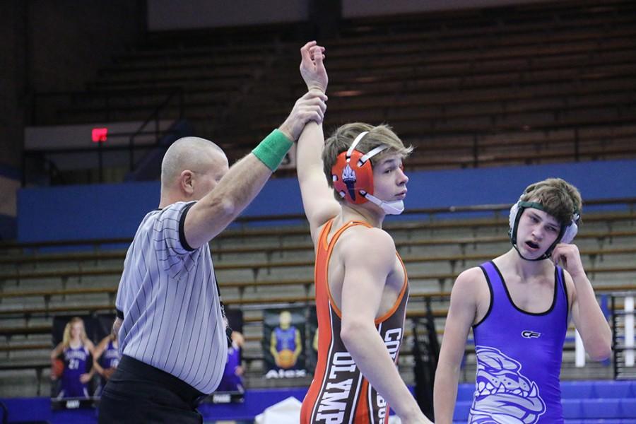 Sophomore Dawson Combest is announced the winner of his match against North wrestler Dallin Anderson.