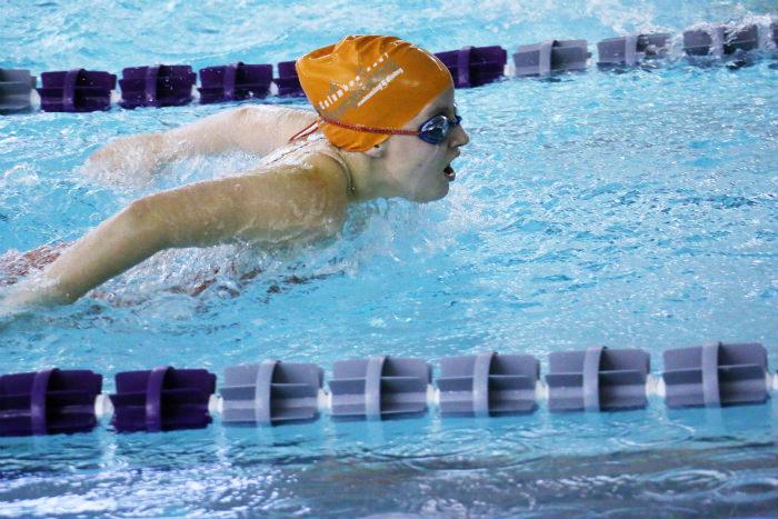 Freshman Quinn Phillips swims the butterfly leg of the 200 yard Individual Medley.