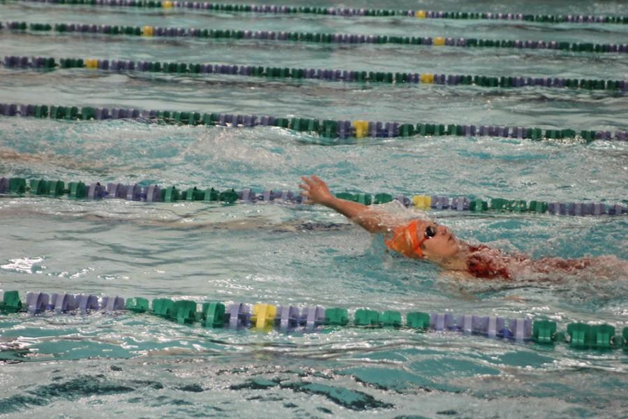 Sophomore Lizzy Frazier competes in the backstroke leg in the 200 yard medley relay. 