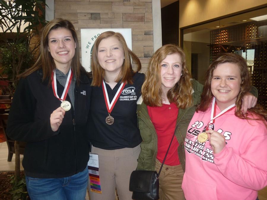 Sophomore Kari Erwin, freshman Madi Schutte, freshman Megan Holl and Cassie Claycamp pose for a photo at the FCCLA State Leadership Conference.