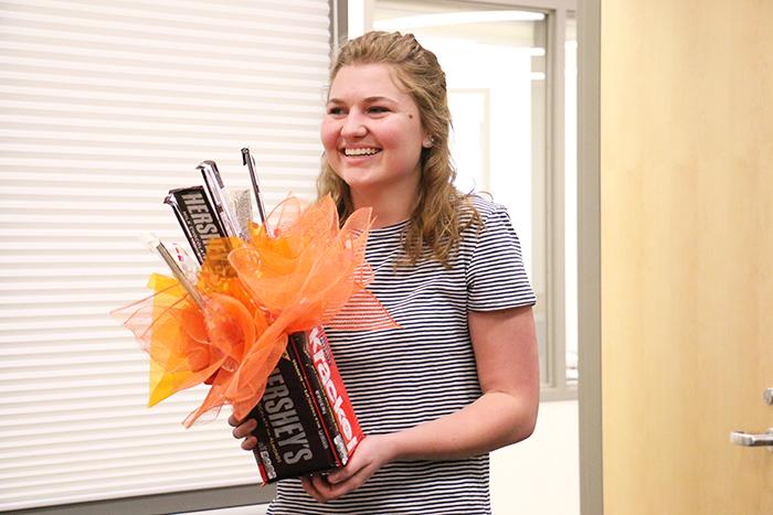 Senior Bryn Eudy holds a selection of chocolate after learning she is a recipient of the 2016 Lilly Endowment Scholarship.