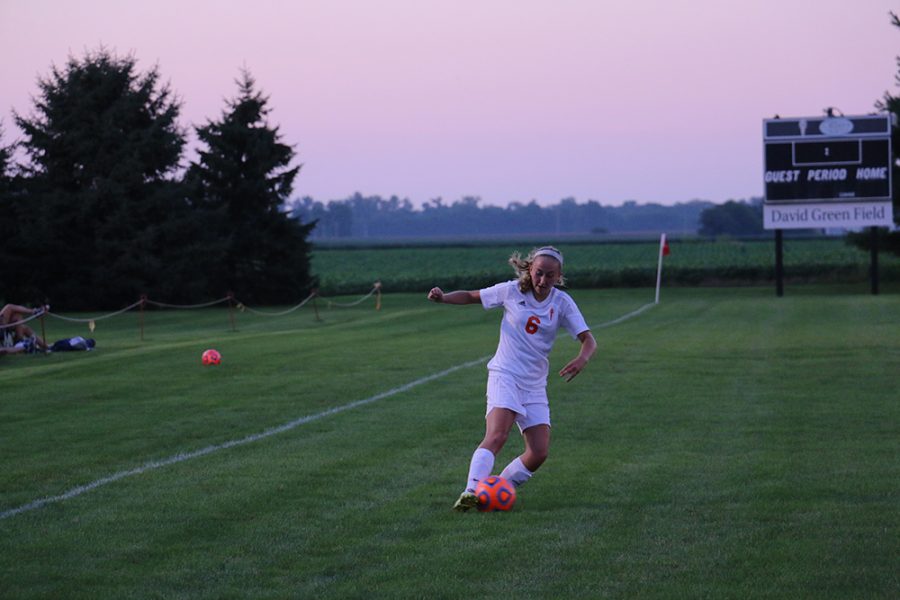 Senior Karlee Dowd speeds down the side before whipping in a cross.