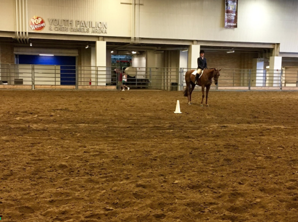 Junior Liz Kroger rides in her equitation class.