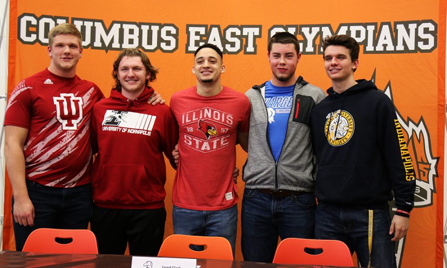The signees pose for a picture together.