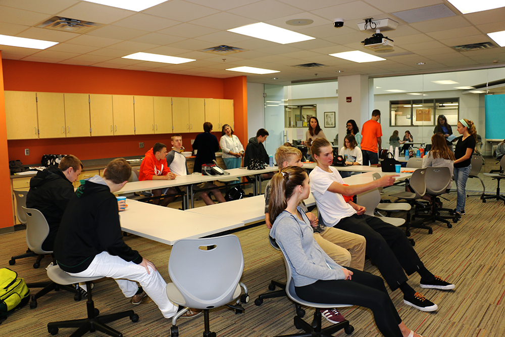 Students gather in the orange room Thursday for National Day of Prayer.