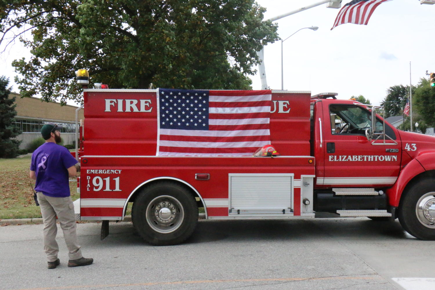 An Elizabethtown fire engine displays an American flag along the route for Sgt. Hunters funeral procession.