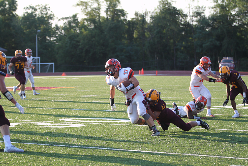 Sophomore Dalton Back is tackled after a catch.