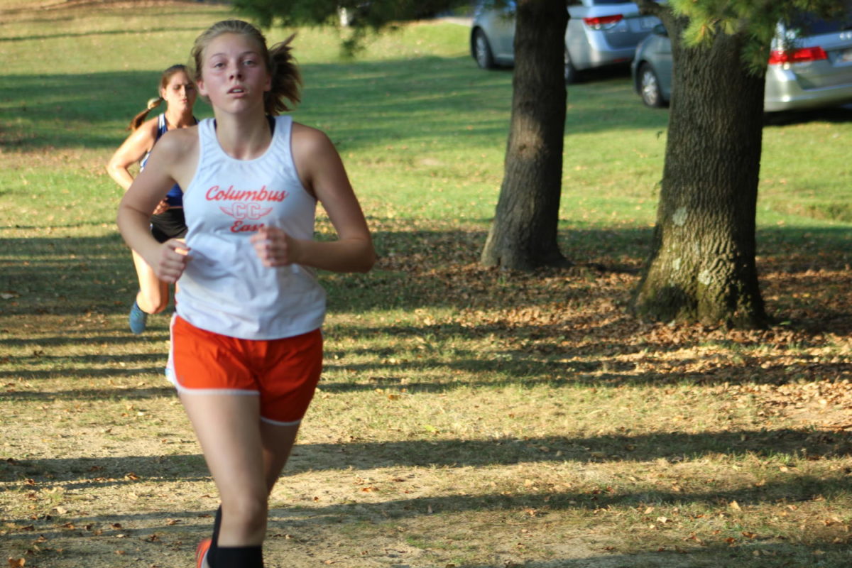 Sophomore Olivia Linnemann zooms past a North runner.