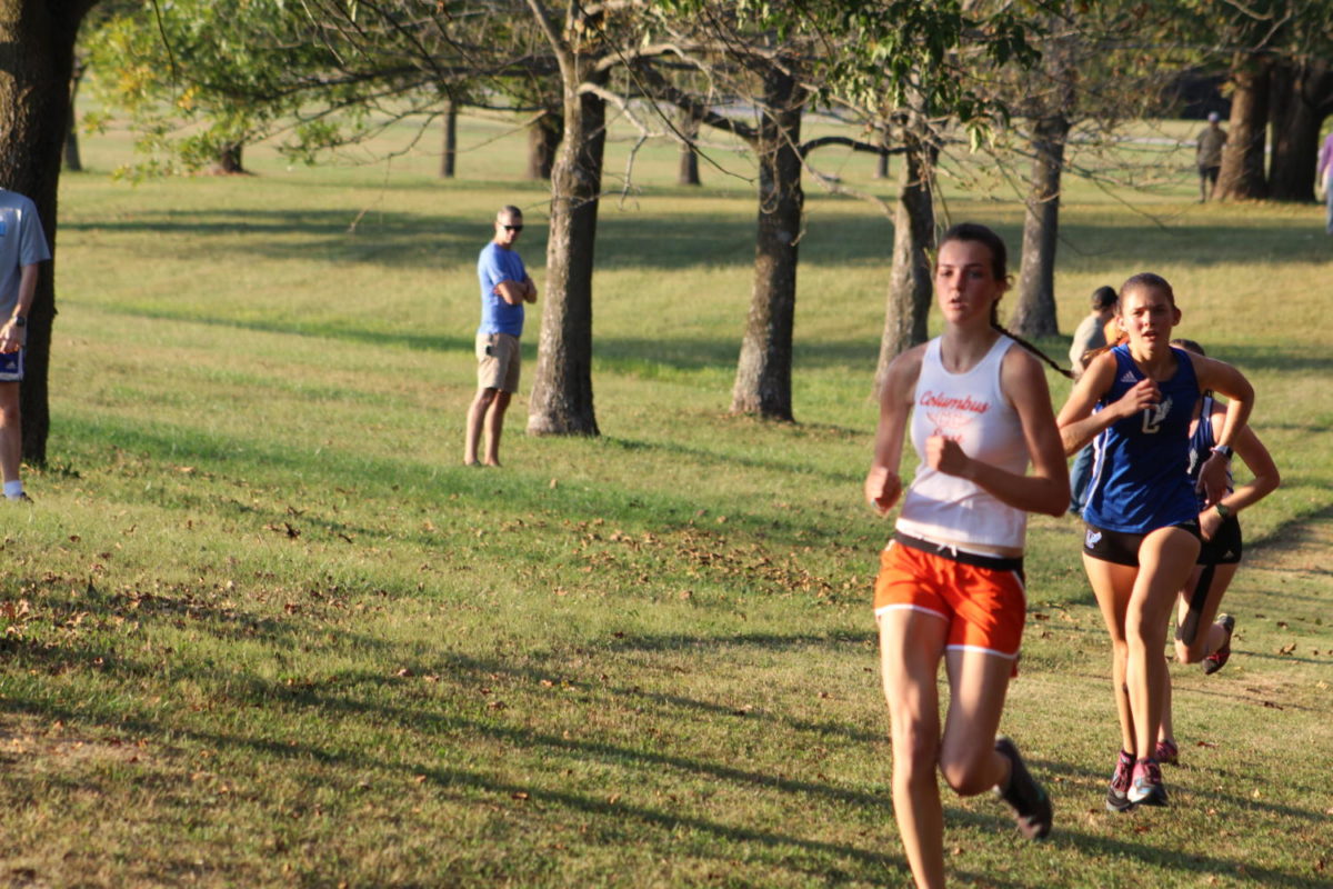 Senior Kristen Lyons leads a pack in the race.