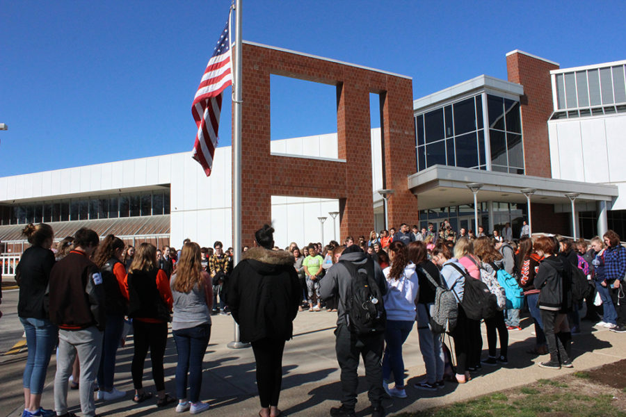 Students gather outside of school for the walkout. 