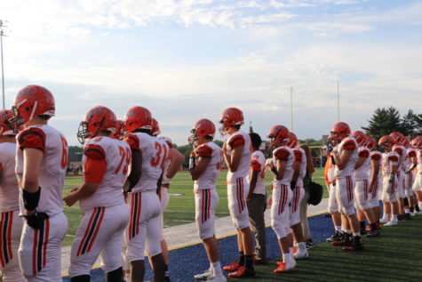 Team lines up for coin flip.