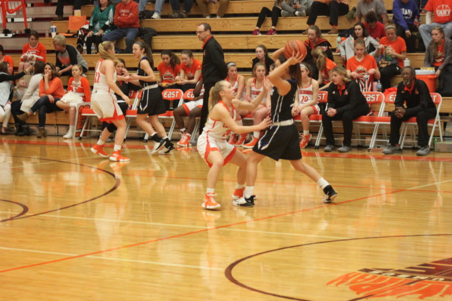 Junior Claire Cunningham  guards their point guard.