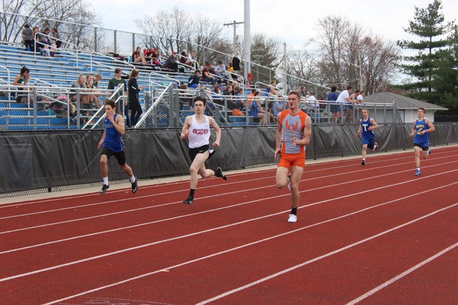 Junior Seth Chandler races his opponents in the 400 meter run.