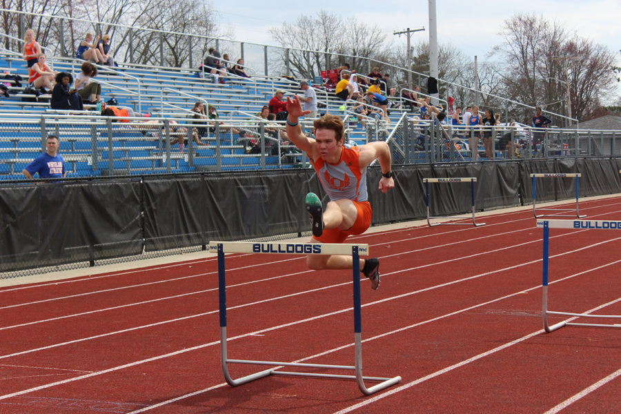 Senior Owen Rupp uses perfect form when jumping over the hurdle.