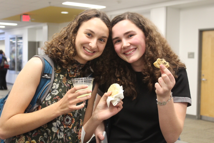 Seniors Maggie Buffo and Kamebry Wagner celebrate with lemonade and cookies.