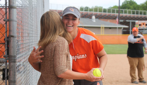 Senior third baseman Brooke Valles hugs her mentor.