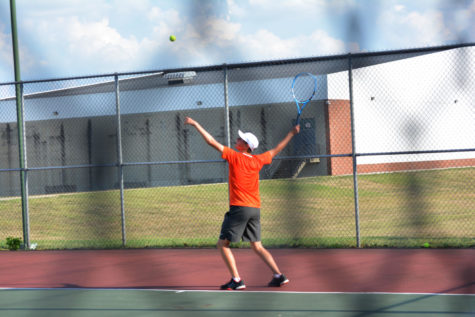 Freshman Matthew Degner serves the ball.