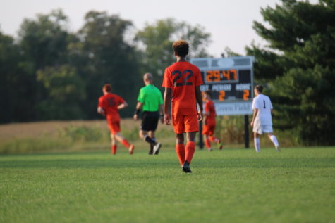 Sophomore Chris Quisenberry walks up the field.