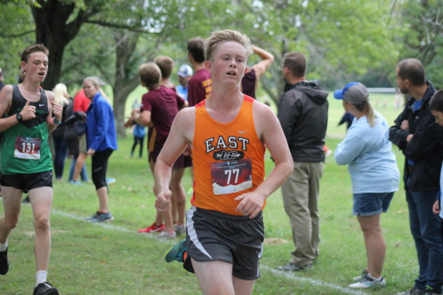 Junior Kaden Wise running towards the finish line.