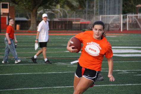 Sophomore Koryn Greiwe runs down field with the ball.