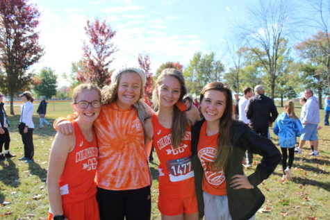 Sophomores Olivia Shoaf, Sammie Gilbert, Laurel Knight and Mallory Rupp get together for a photo after the varsity race.