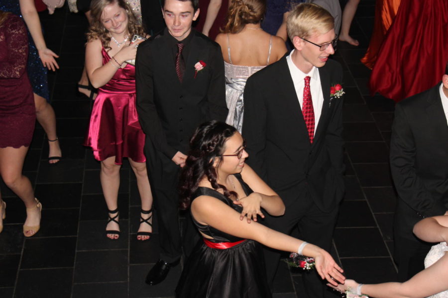 Sophomore Alexis Kieninger dances to the Macarena with North senior Chase Holland.