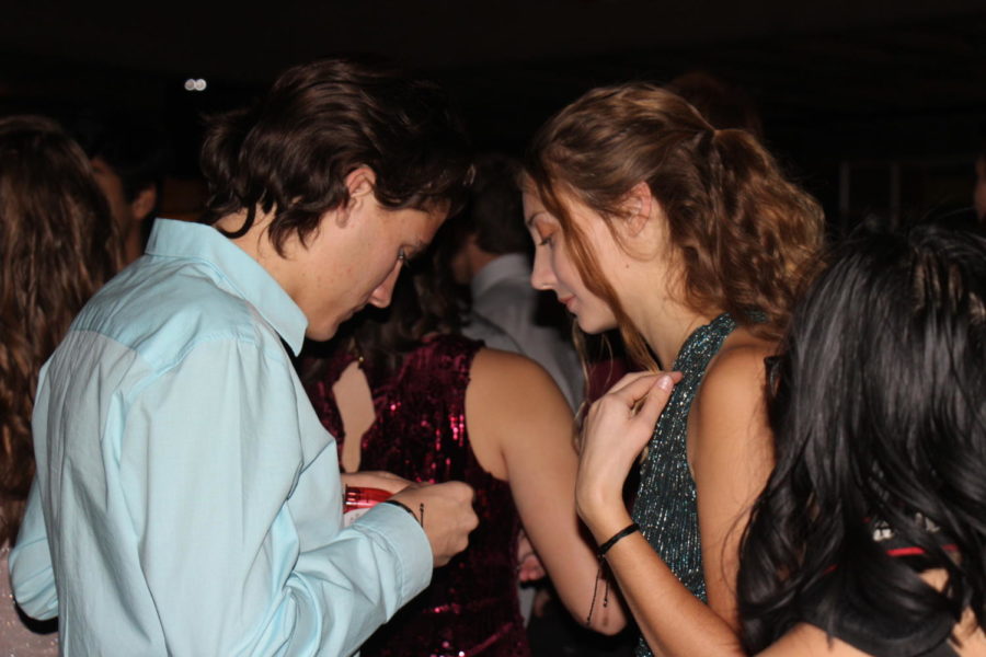 Seniors Caleb Walters and Elena Stoughton stand on the dance floor.