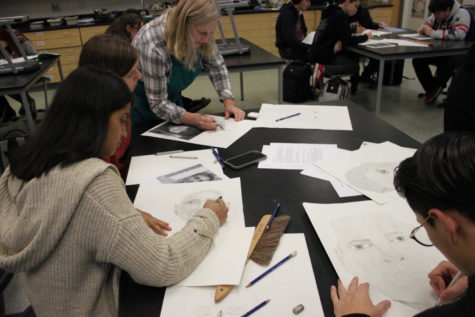 Students work diligently with the help of Mrs. Kocur.