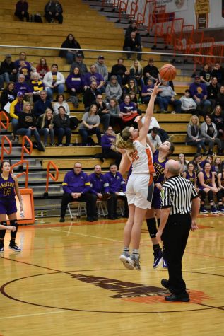 The varsity team starts the game with a tipoff, with East getting the ball.