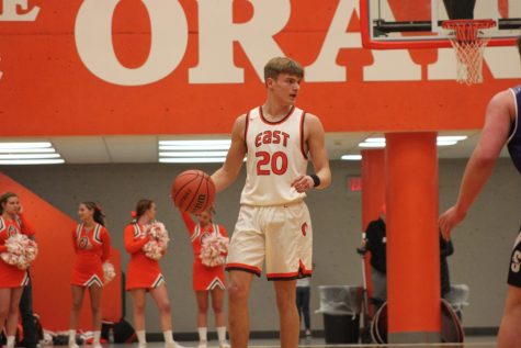 Junior Crase Bergman dribbles down the court.