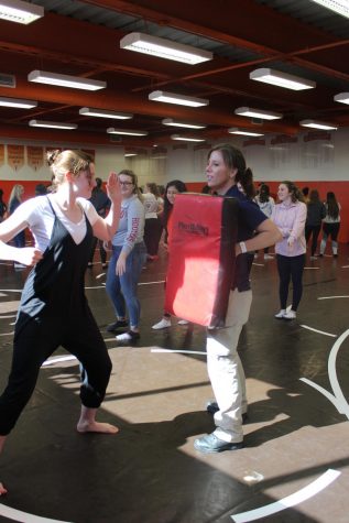 Senior Jennifer Utterback stands in a fighting stance.