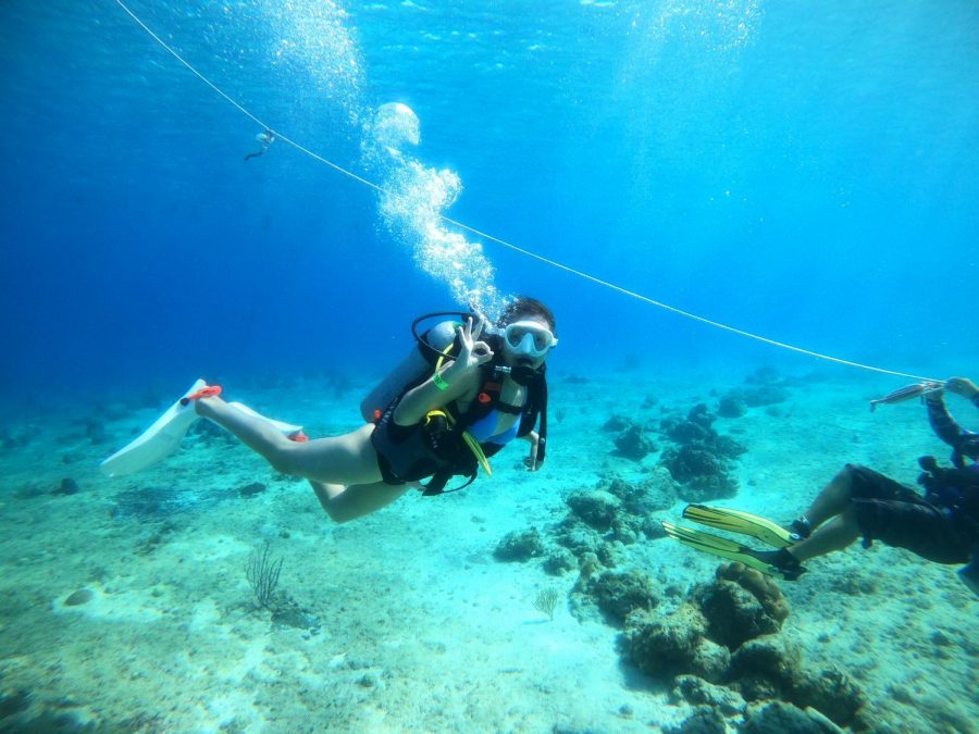 Junior Monica Burton scuba dives for the first time. Burton plans on obtaining her certification for scuba diving once she gets back home. 