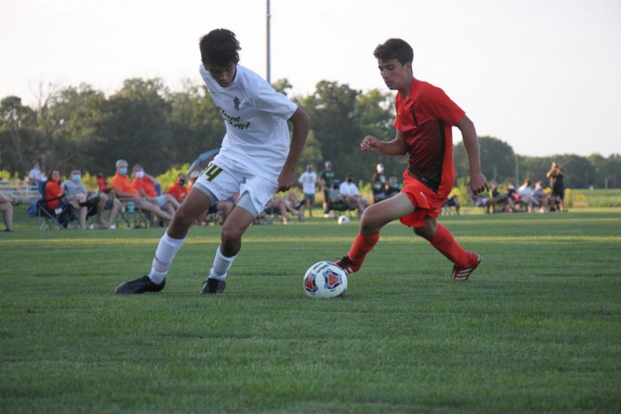 Junior Weston Romine challenges a defender.