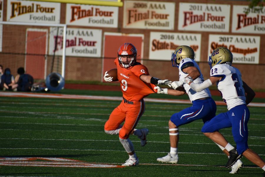 Senior Crase Bergman is pulled down by an Elkhart defender.