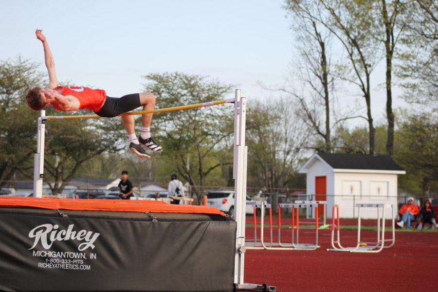 East track student does the high jump event.
