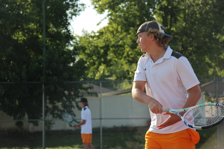 Junior Matthew Degner prepares to serve.