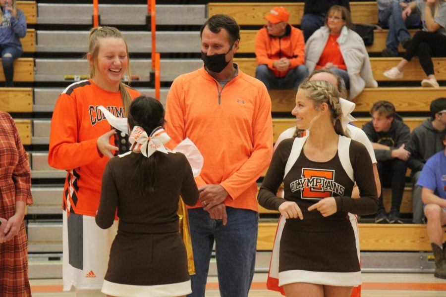 East cheerleaders give gifts during Senior Night 