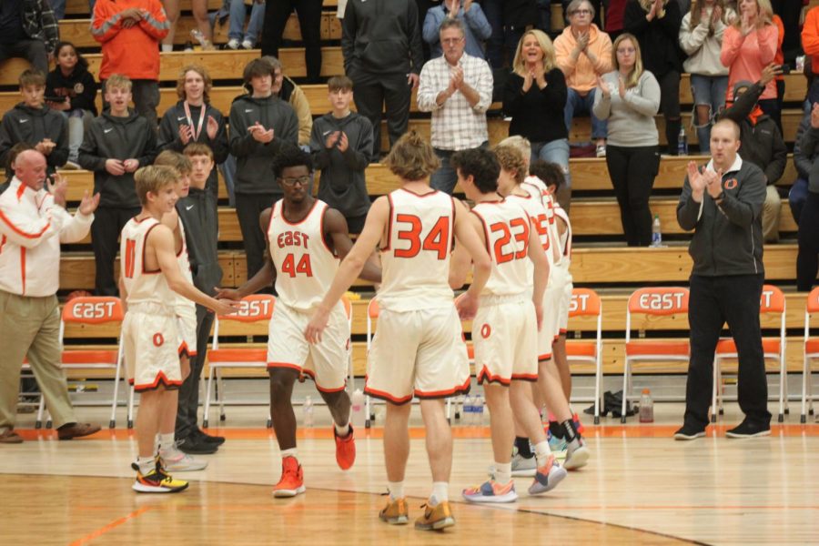 Senior Anthony Lloyd high-fives teammates after being announced.