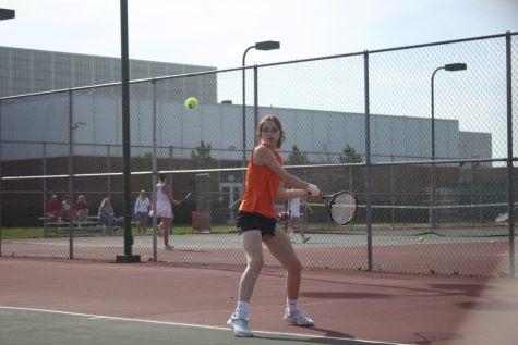 Sophomore Olivia Middendorf hits a shot.