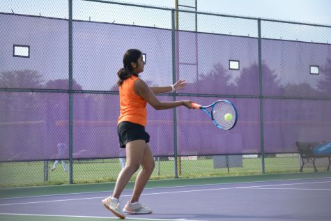 Junior Shruthika Kumar makes contact with the ball.