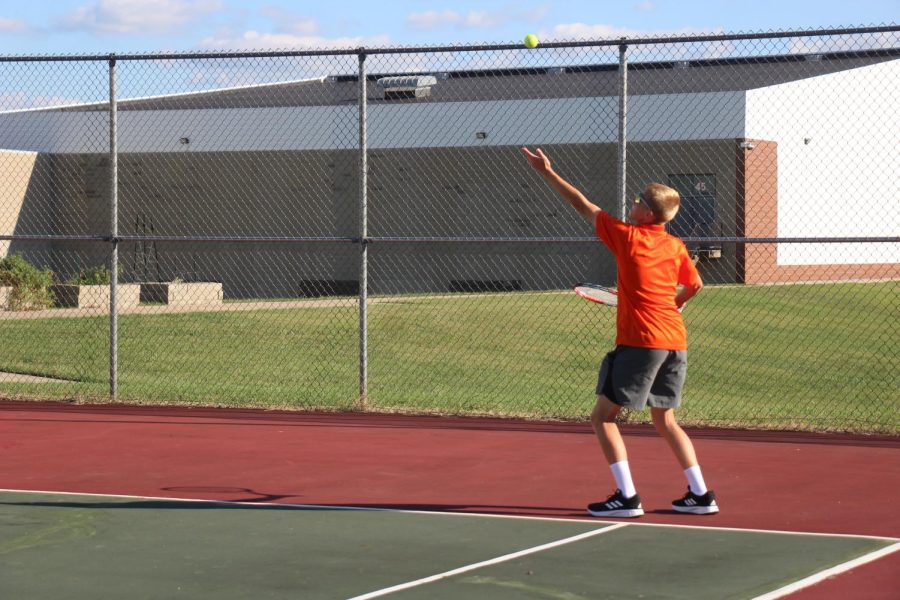 Sophomore Tyler Ernst serves to opponent at two doubles.